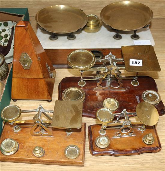 A metronome, three sets of postal scales and a set of kitchen scales